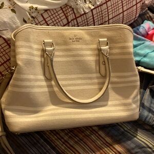 Almost new Cream and white striped Kate Spade purse. Good size purse